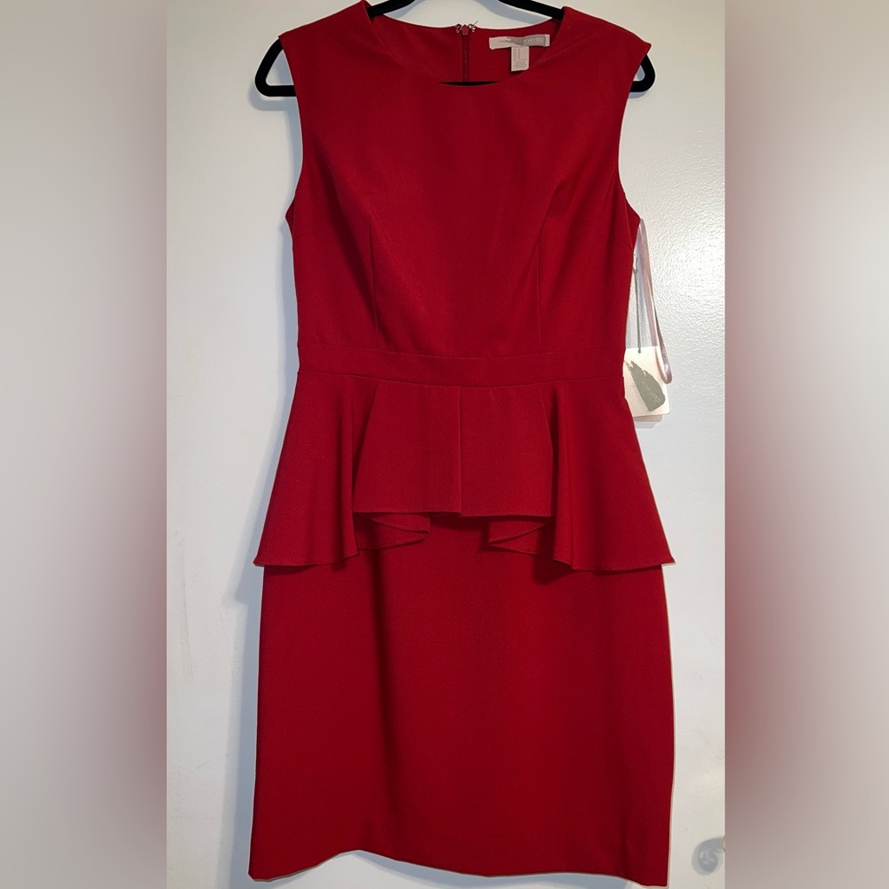 New! With tags. Red sleeveless peplum dress.